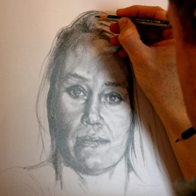 Artists Peter Strobos sketching the portrait of the pencil study.